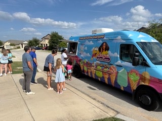 Amaya's Ice Cream Truck serving a neighborhood